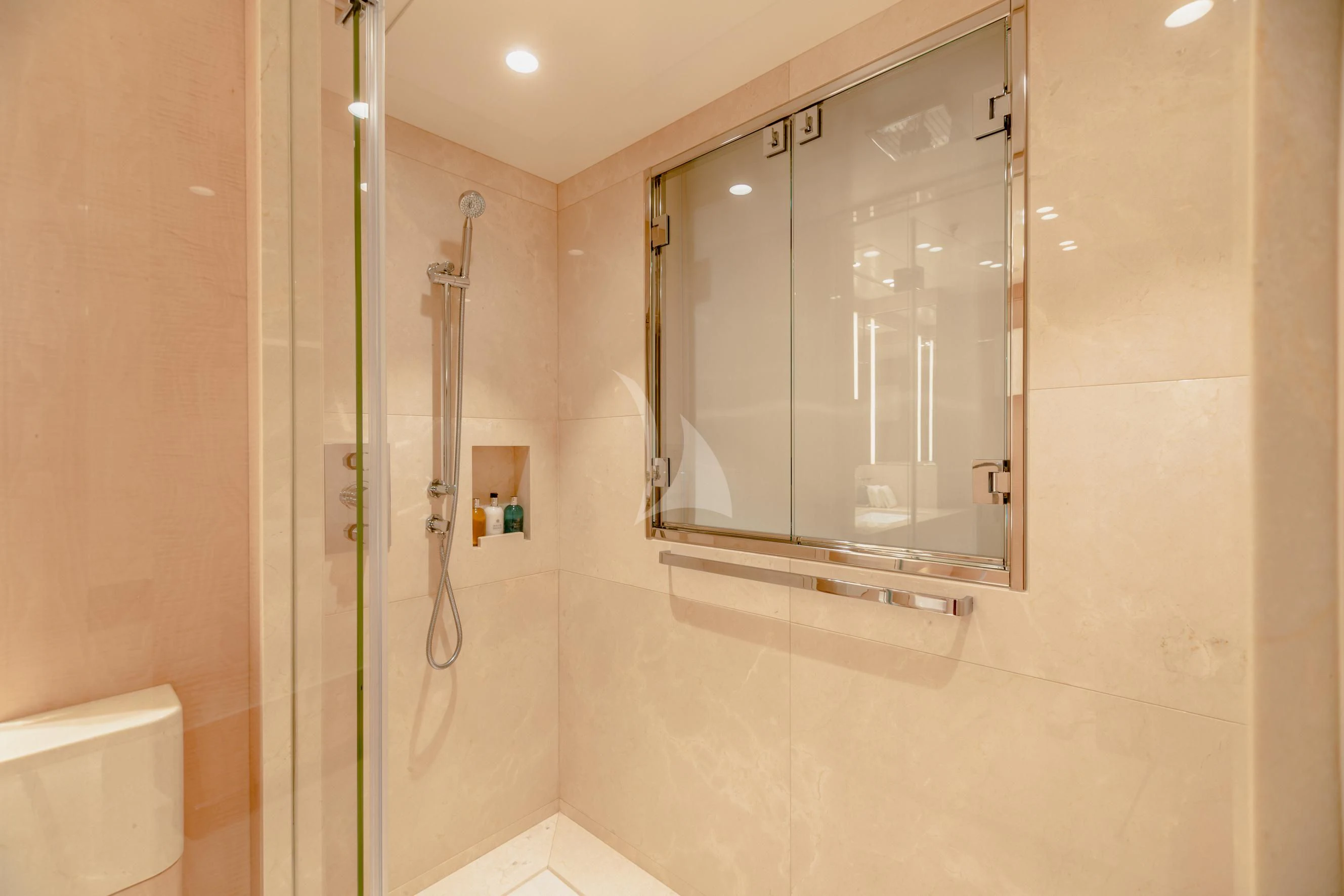 a bathroom with a glass shower aboard CALEX Yacht for Sale