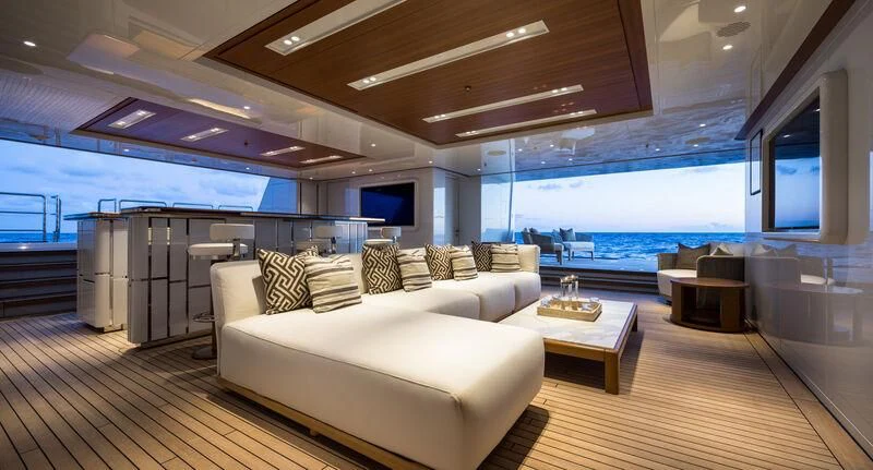 a living room with a large window aboard CALEX Yacht for Sale