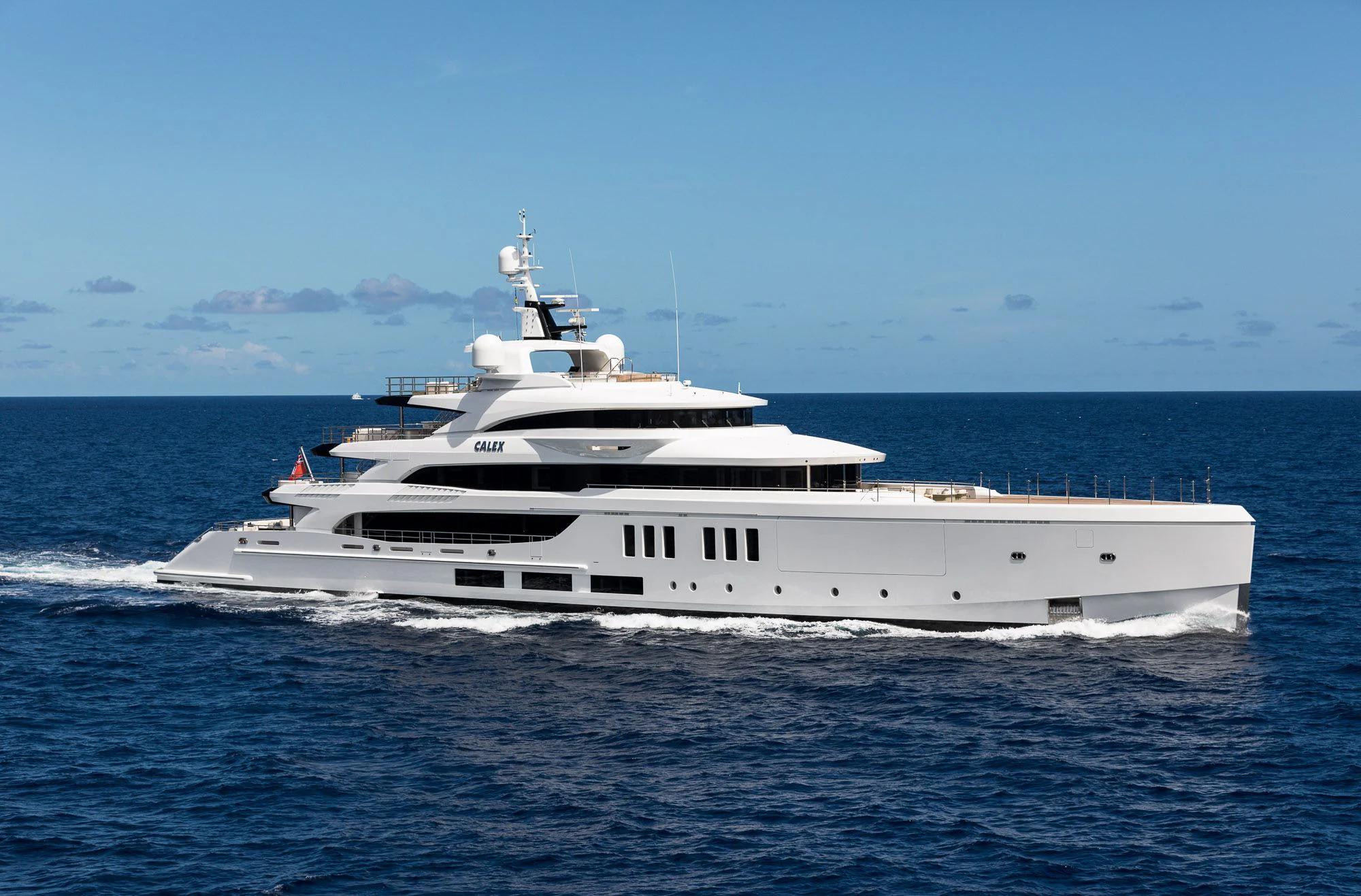 a white yacht in the water aboard CALEX Yacht for Sale