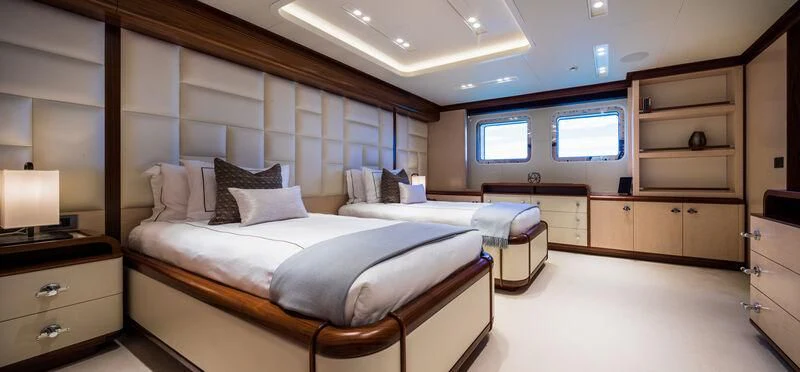 a room with two beds aboard CALEX Yacht for Sale