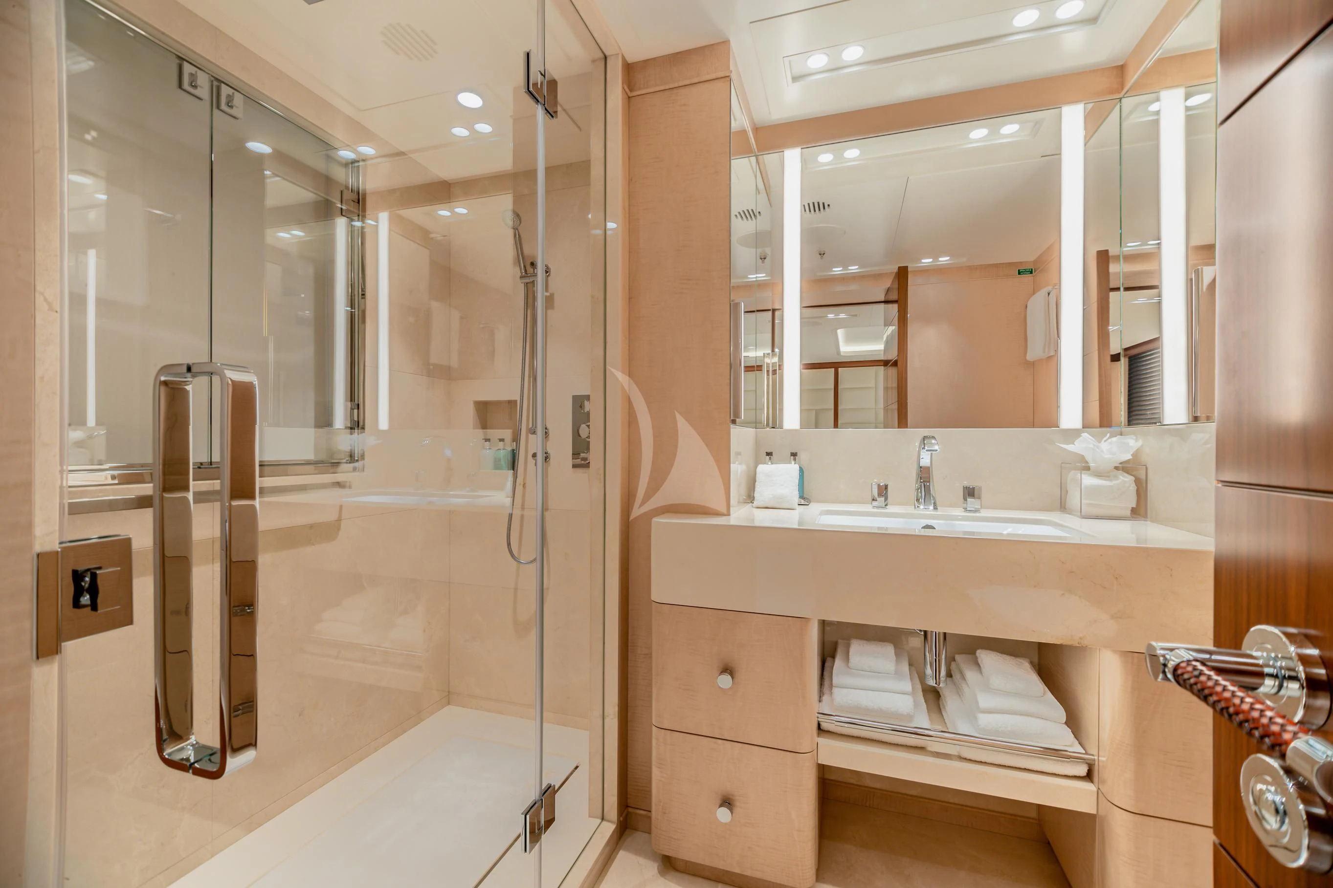 a bathroom with a glass shower aboard CALEX Yacht for Sale