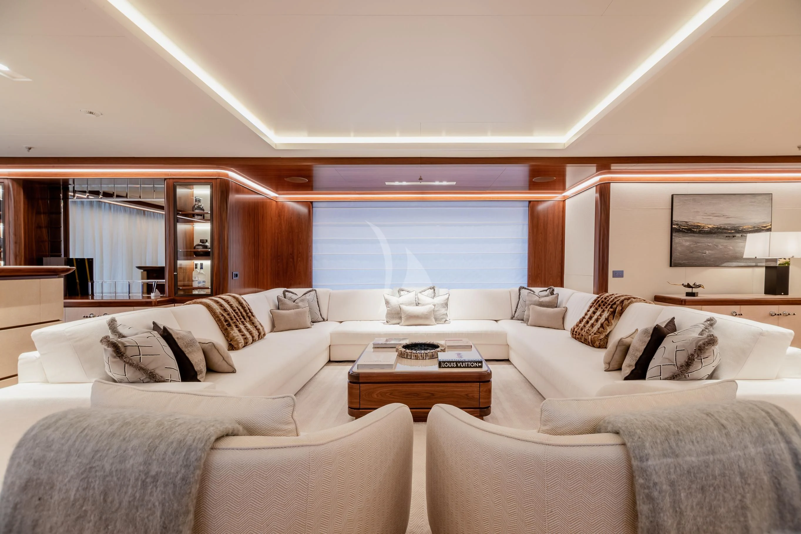 a living room with a large window aboard CALEX Yacht for Sale