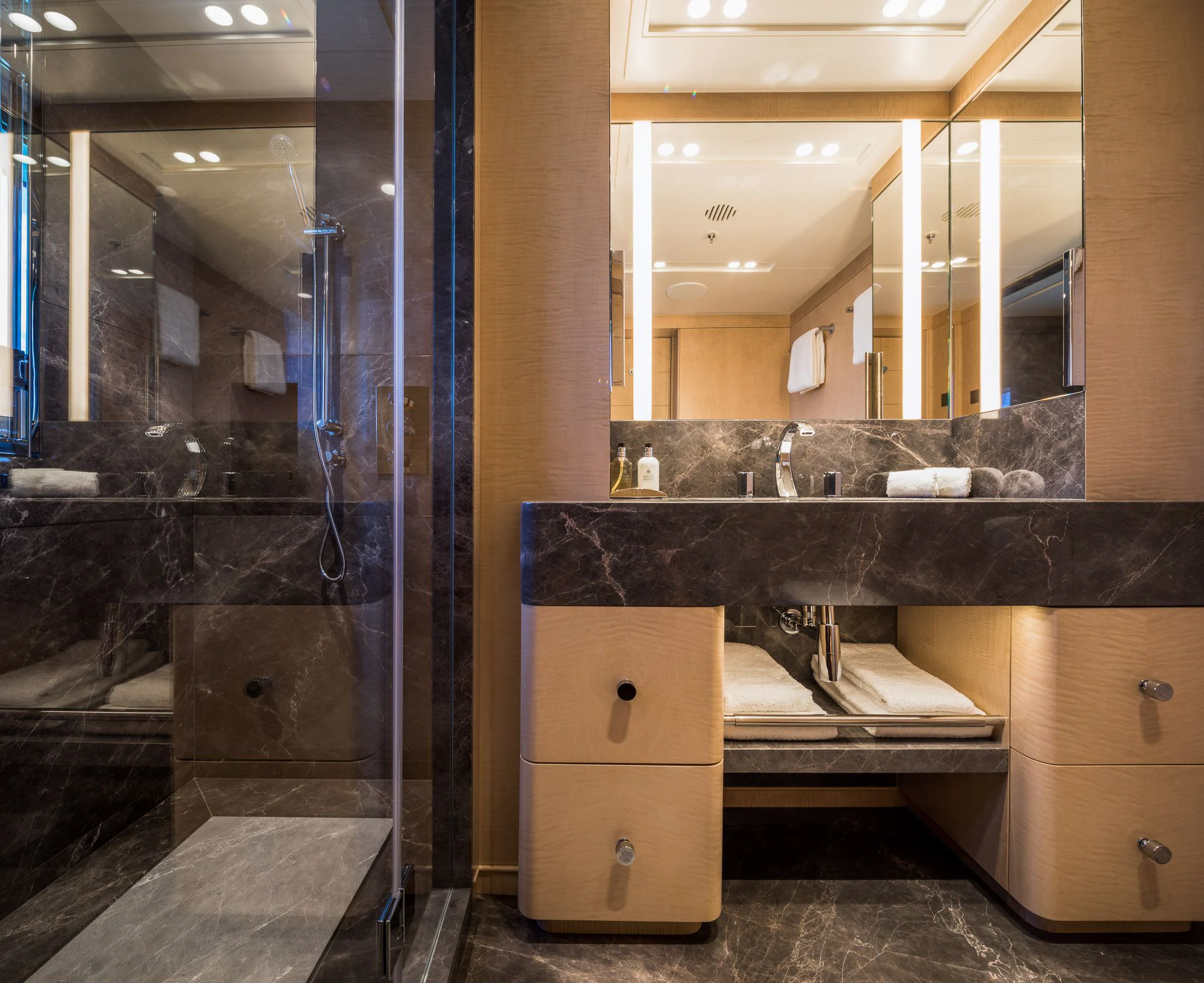 a bathroom with a large glass shower aboard CALEX Yacht for Sale