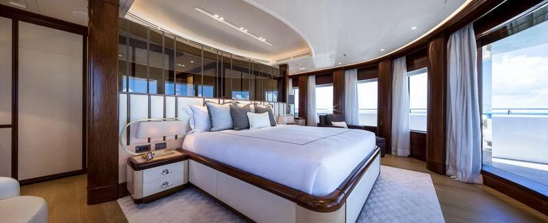 a large bedroom with a large bed aboard CALEX Yacht for Sale
