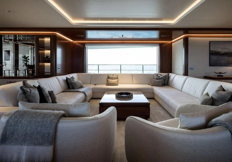 a living room with a large window aboard CALEX Yacht for Sale