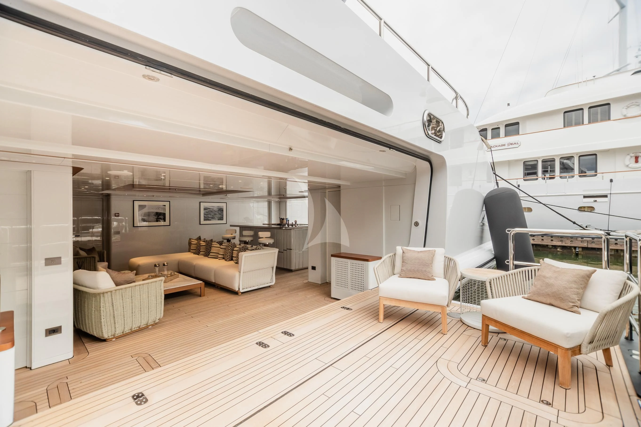 a living room with a large ceiling aboard CALEX Yacht for Sale