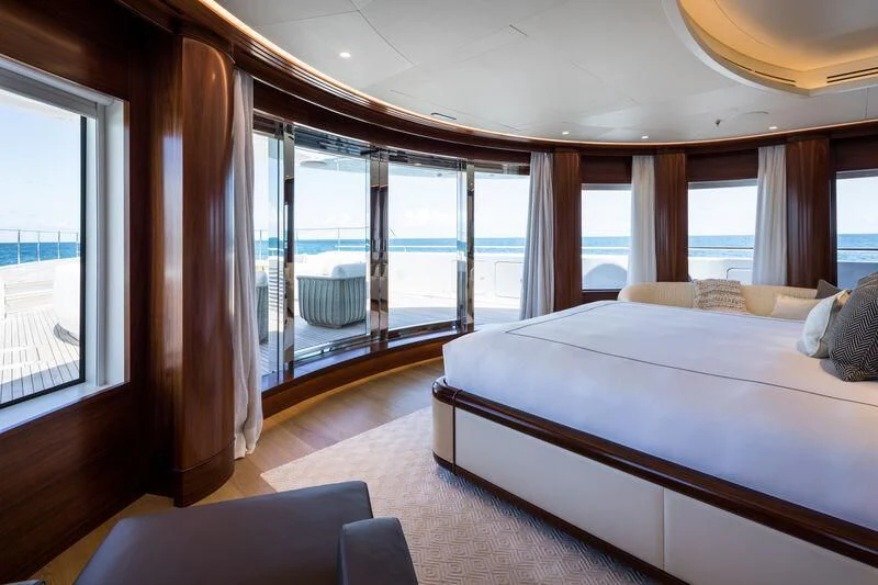 a bedroom with a large bed aboard CALEX Yacht for Sale