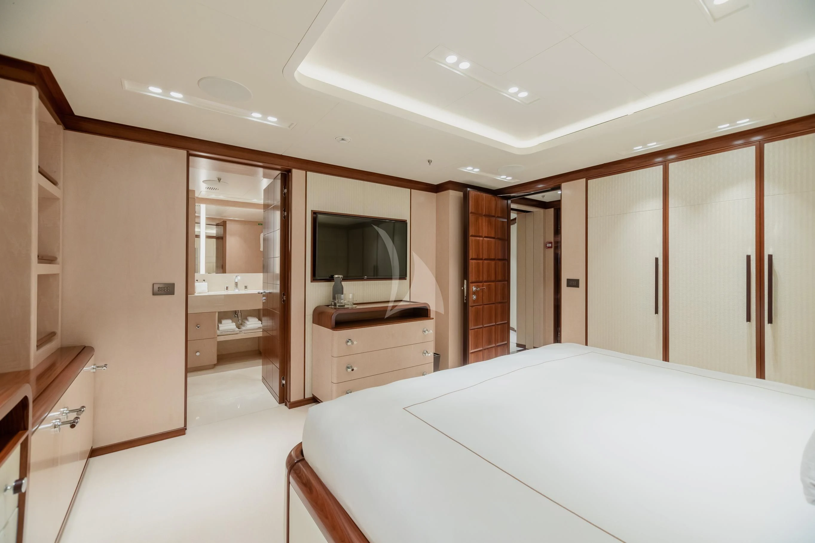 a room with a bed and a television aboard CALEX Yacht for Sale