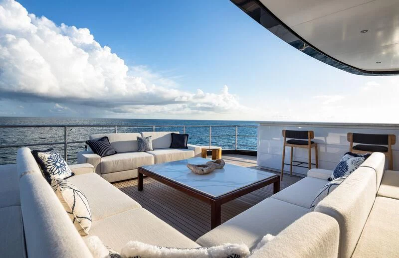 a living room with a large ocean view aboard CALEX Yacht for Sale