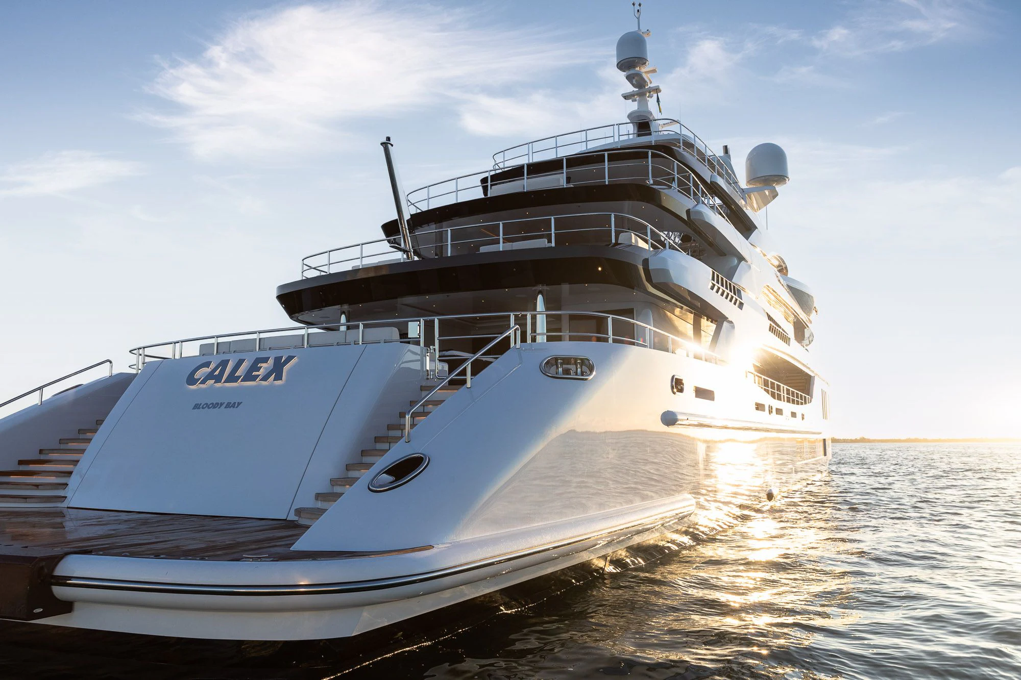 a large white boat on the water aboard CALEX Yacht for Sale