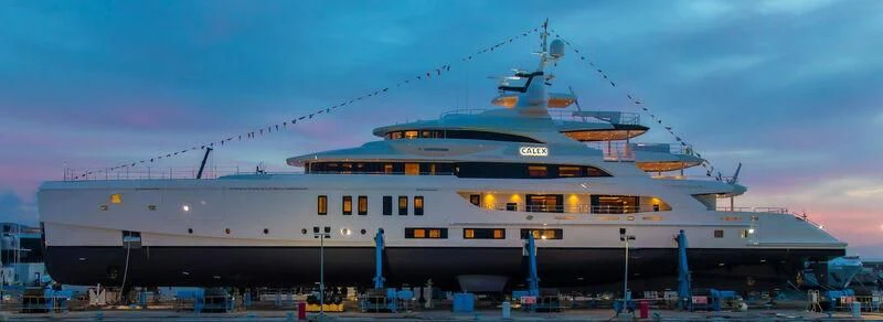 a large ship with a helicopter on top aboard CALEX Yacht for Sale