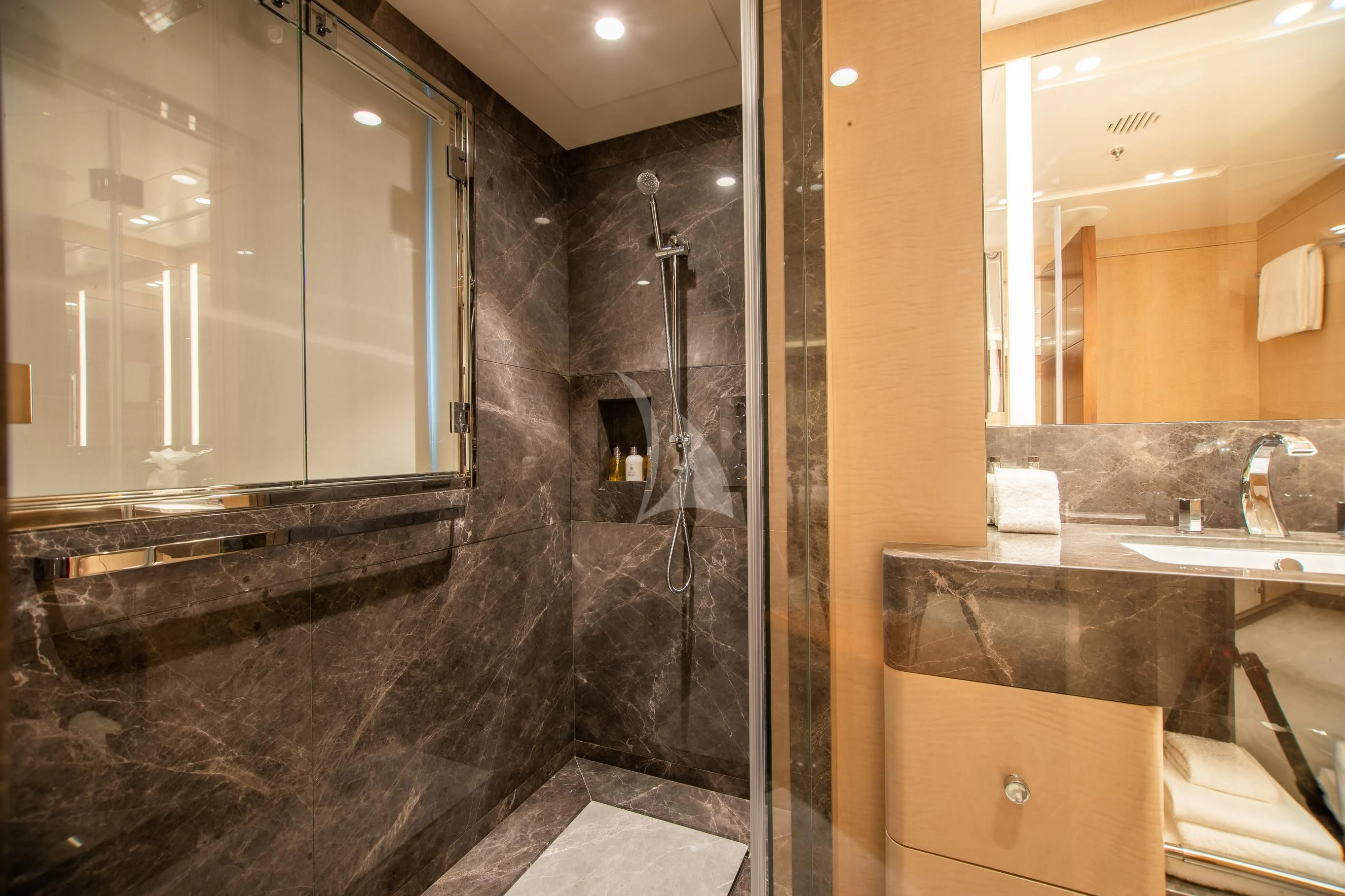 a bathroom with a marble counter aboard CALEX Yacht for Sale