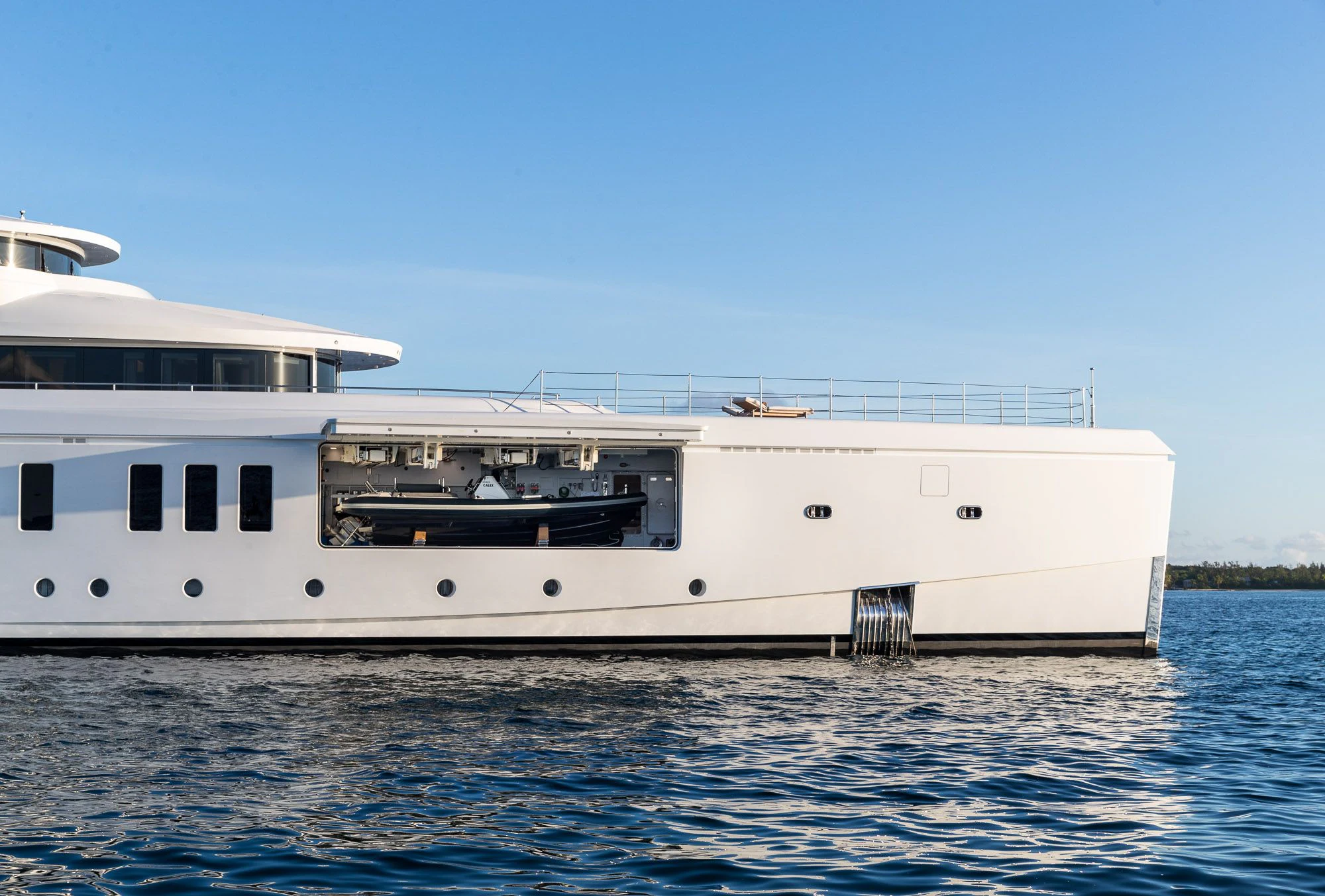 a large white boat in the water aboard CALEX Yacht for Sale
