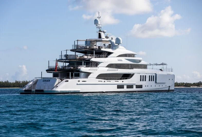 a white boat in the water aboard CALEX Yacht for Sale