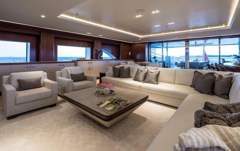 a living room with a large window aboard CALEX Yacht for Sale