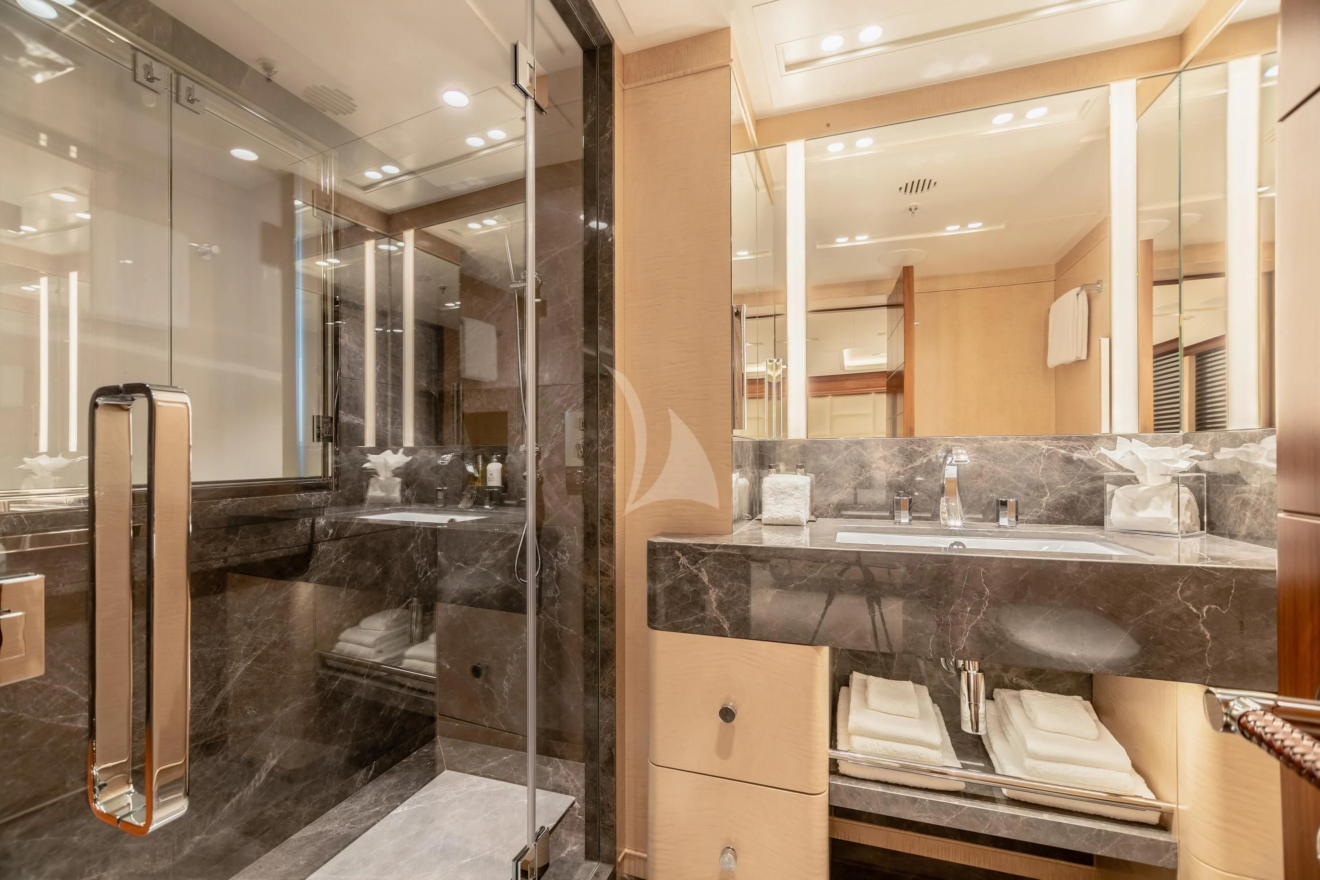 a bathroom with a large mirror aboard CALEX Yacht for Sale