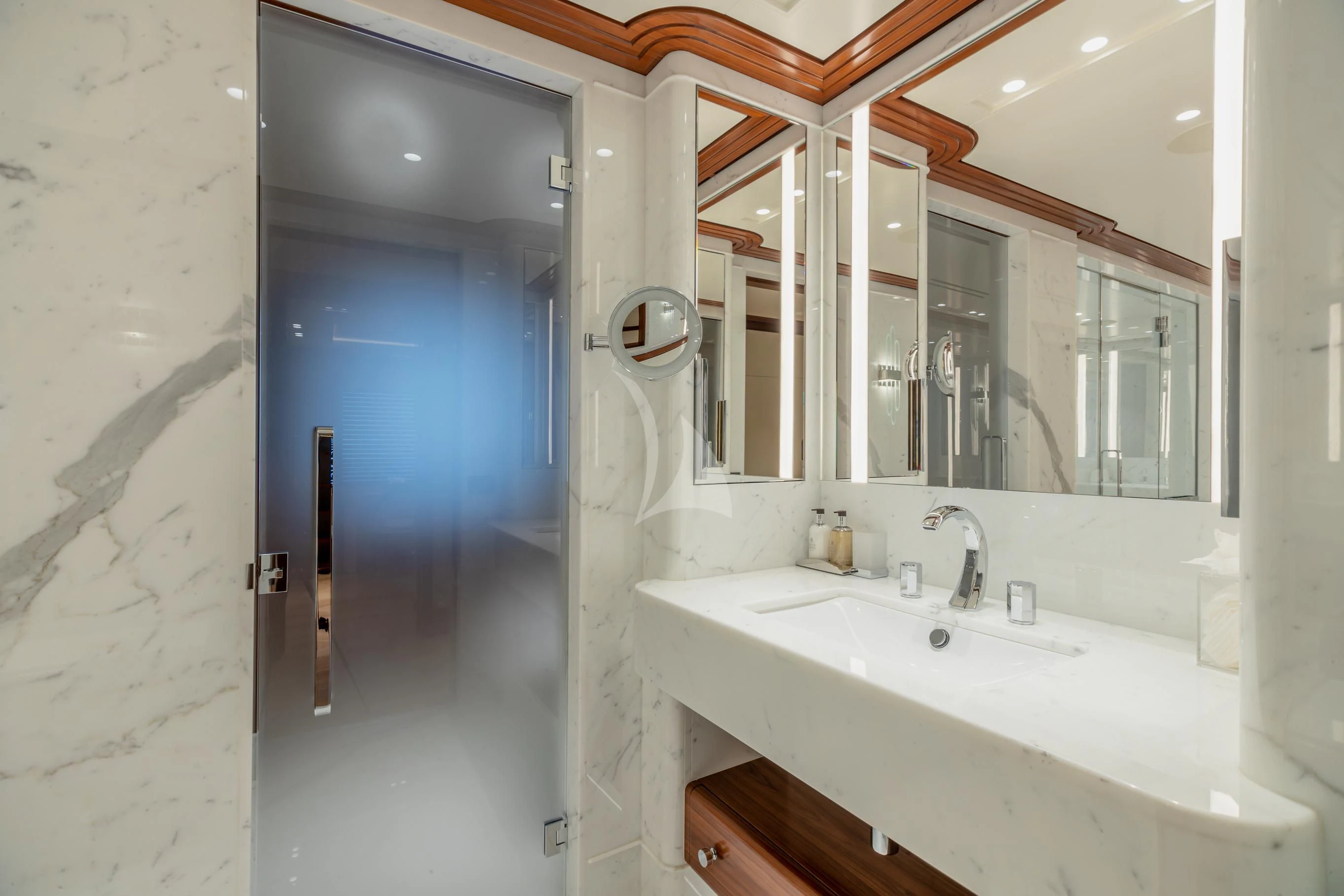 a bathroom with a sink and mirrors aboard CALEX Yacht for Sale