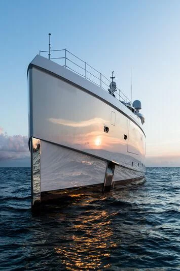 a large white ship in the water aboard CALEX Yacht for Sale