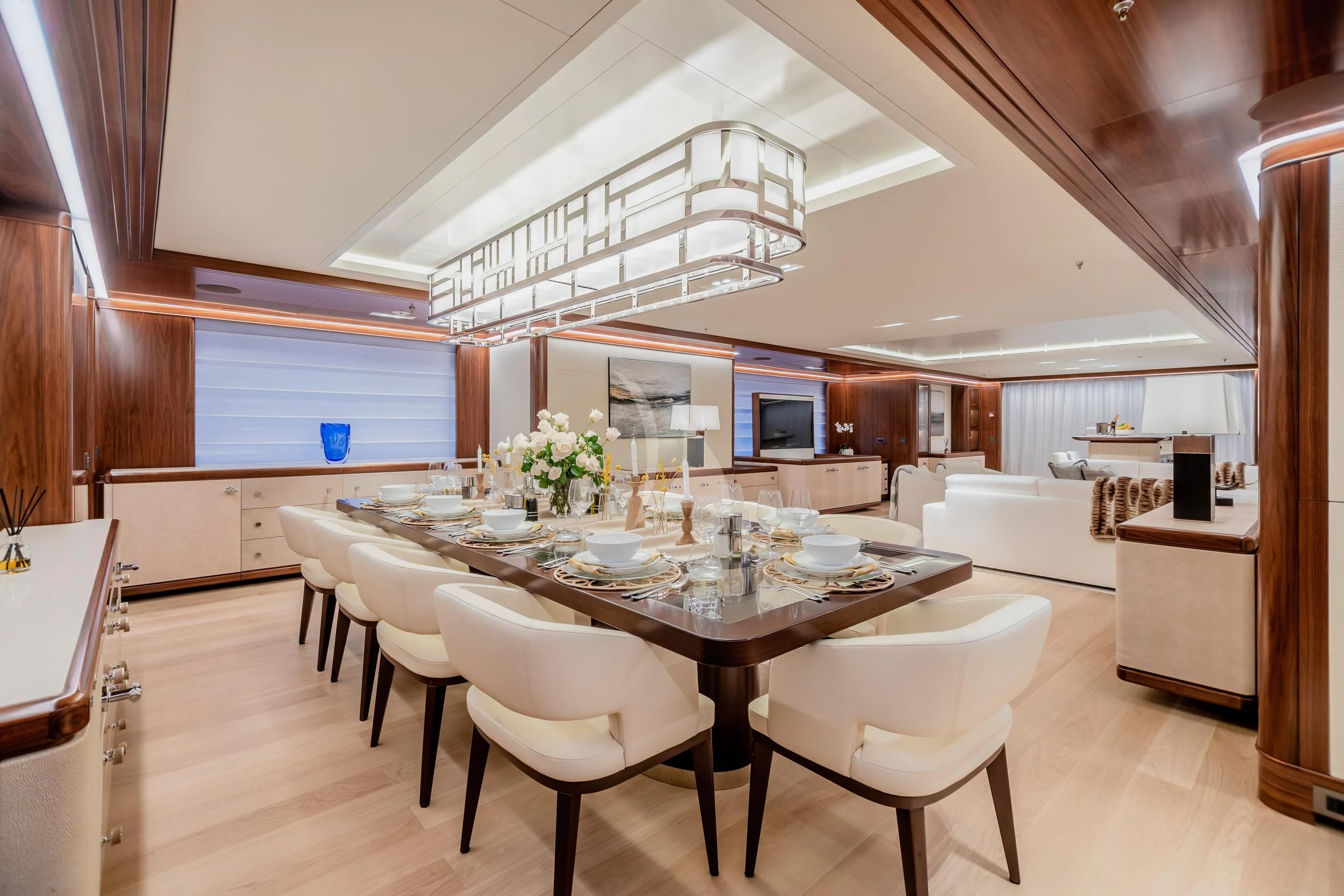 a large kitchen with a table and chairs aboard CALEX Yacht for Sale