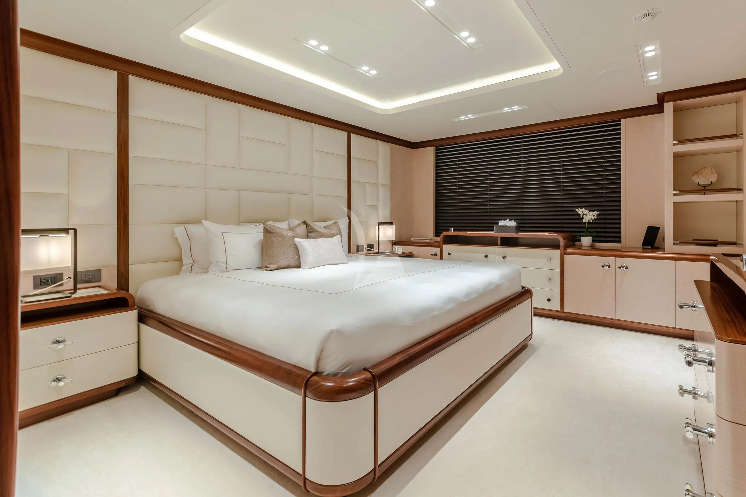 a large bedroom with a bed aboard CALEX Yacht for Sale