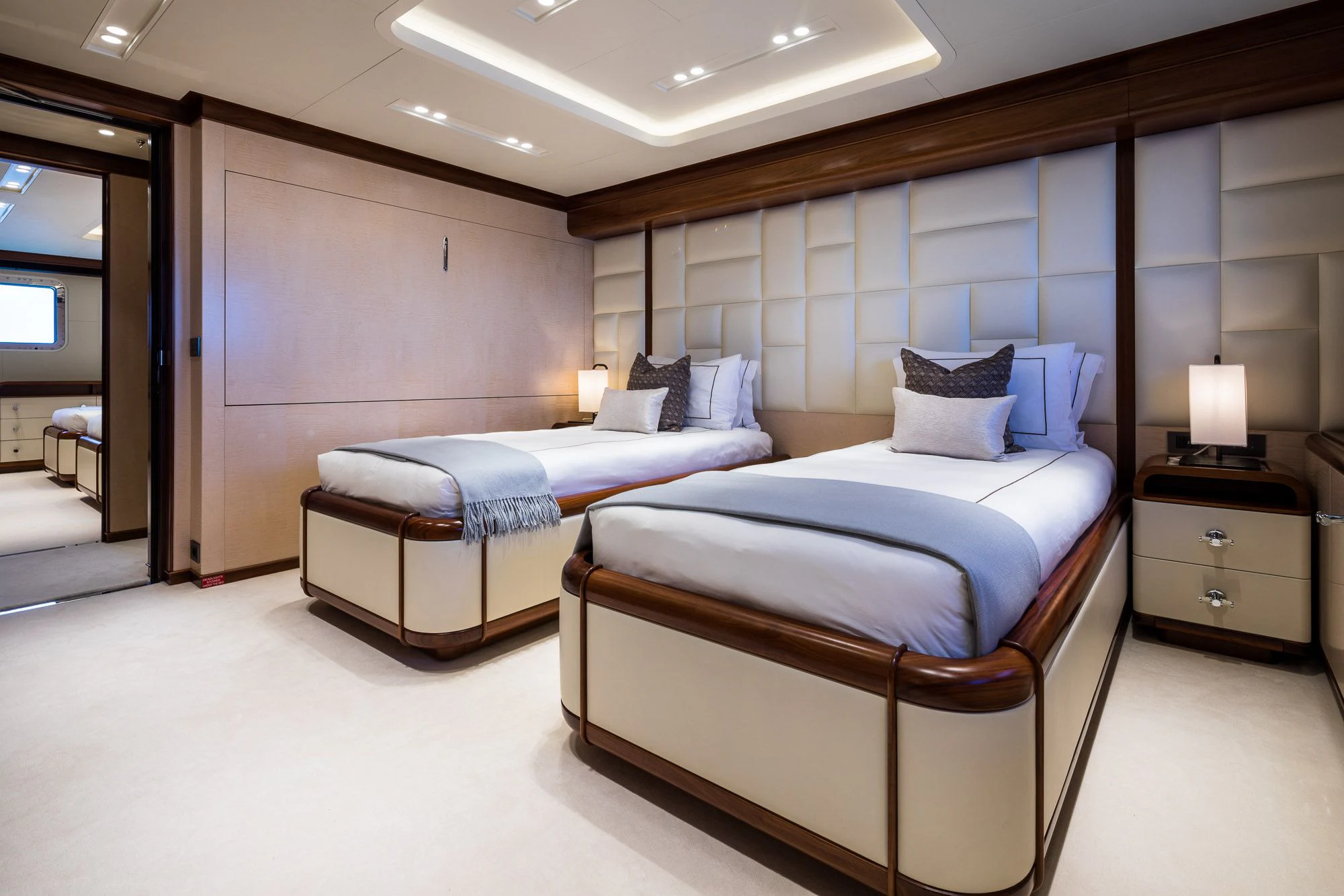 a room with two beds aboard CALEX Yacht for Sale