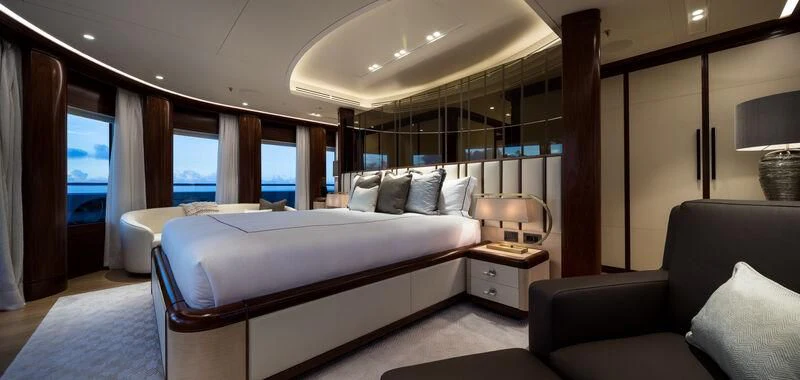 a room with a bed and a couch aboard CALEX Yacht for Sale