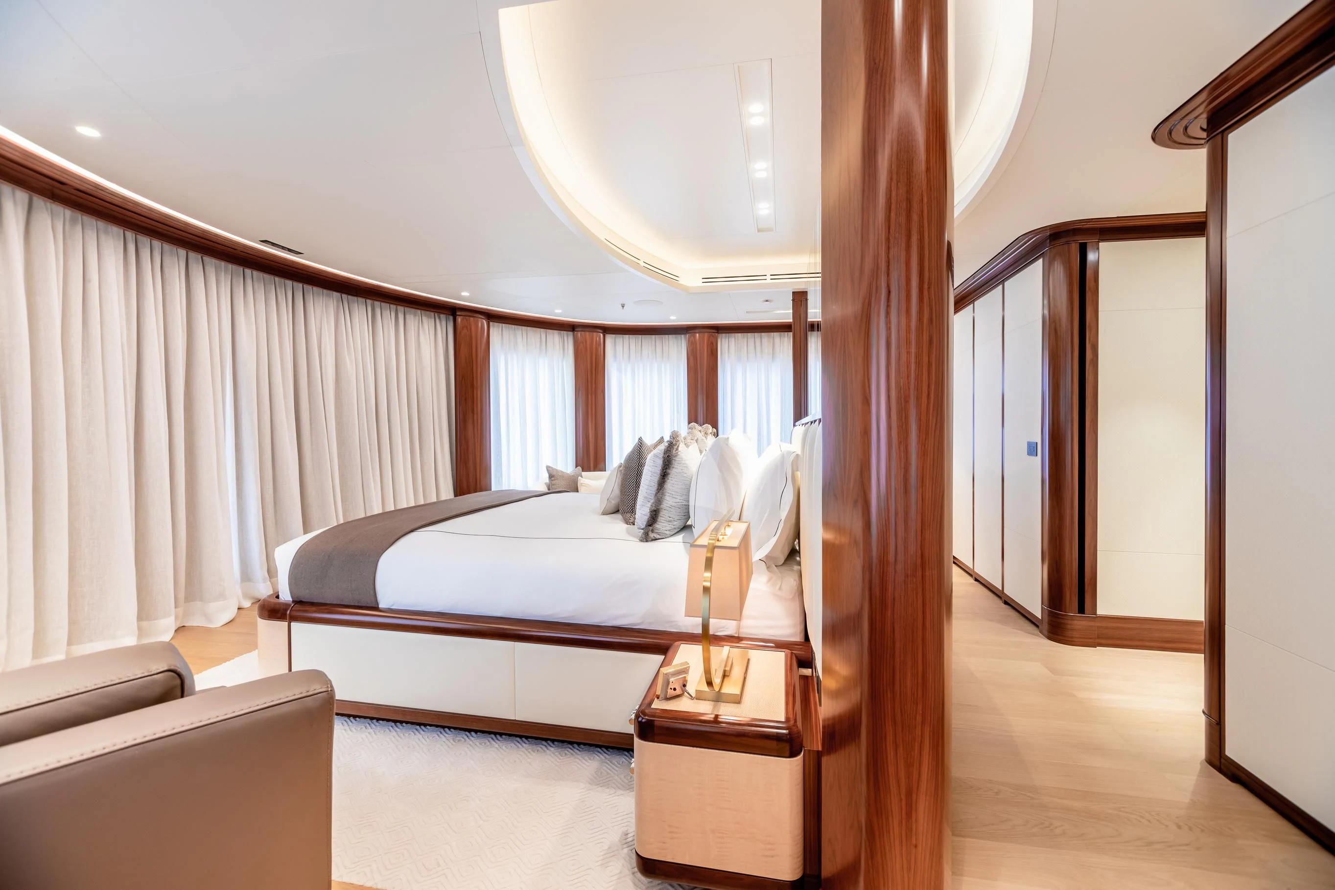 a bed with a white sheet aboard CALEX Yacht for Sale