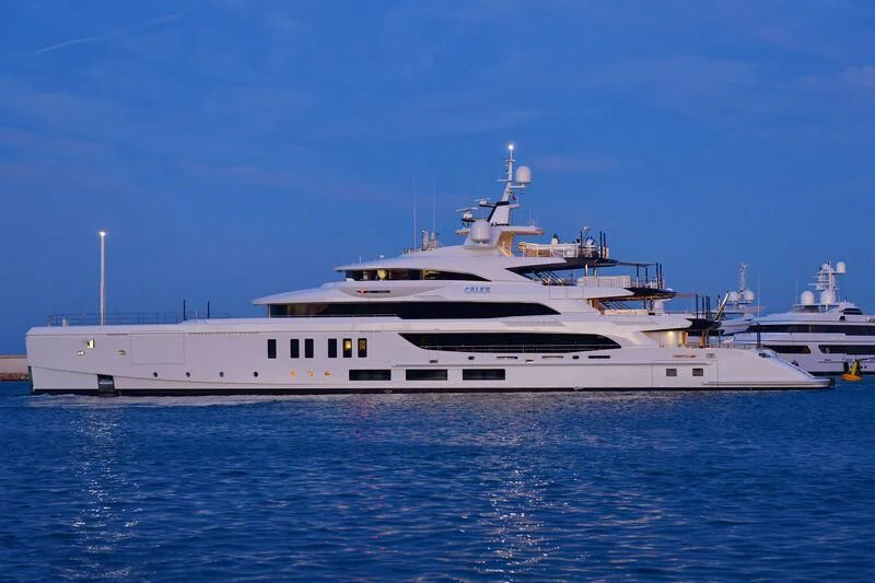 a large white ship in the water aboard CALEX Yacht for Sale