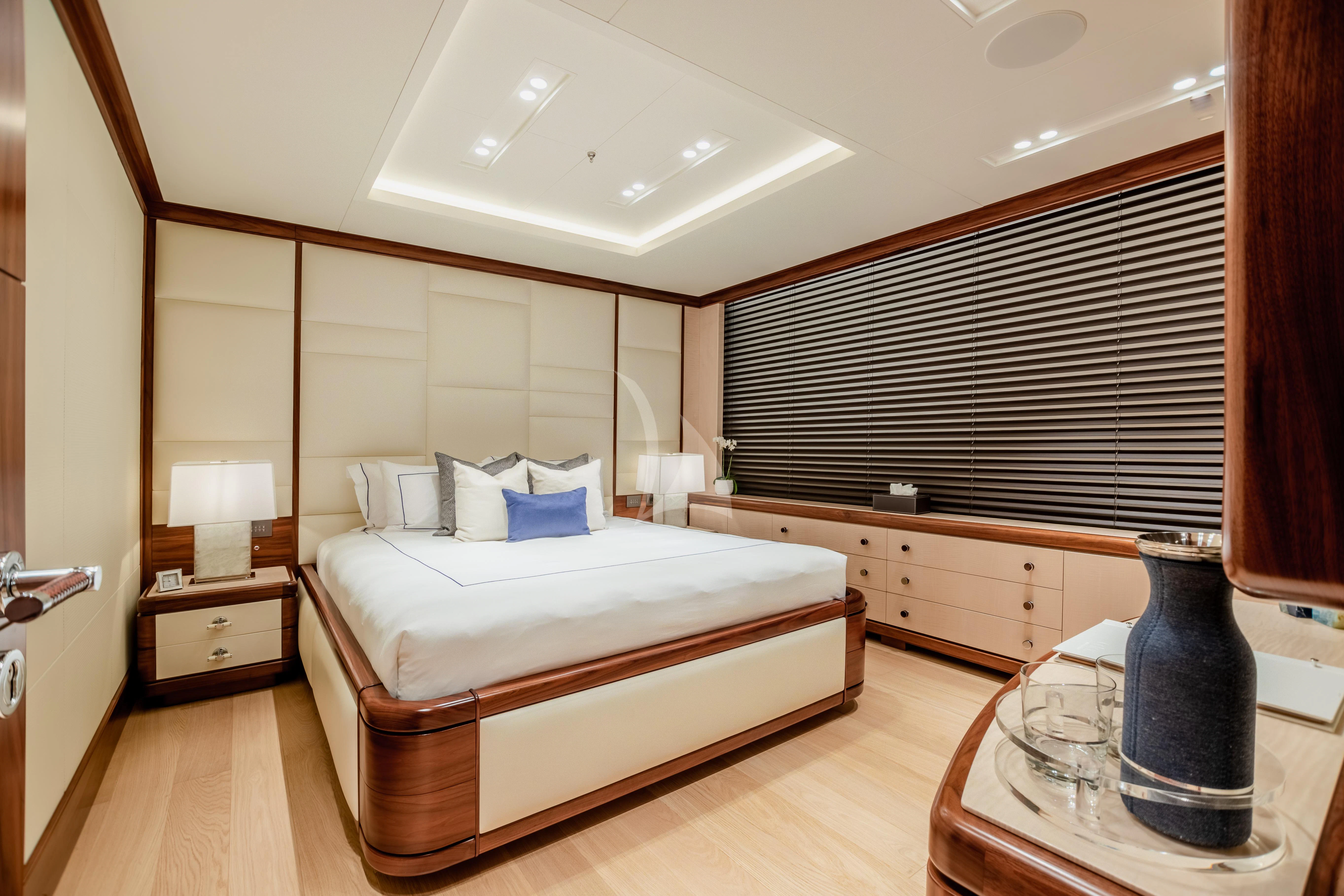 a large bedroom with a large bed aboard CALEX Yacht for Sale