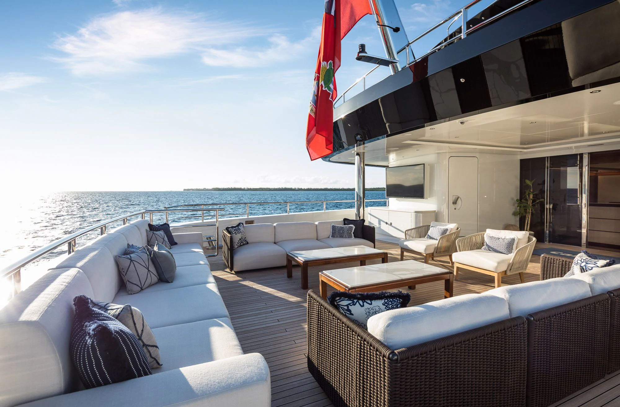 a large living room with a large body of water aboard CALEX Yacht for Sale