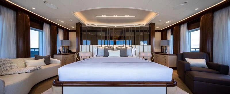 a large bed in a hotel room aboard CALEX Yacht for Sale