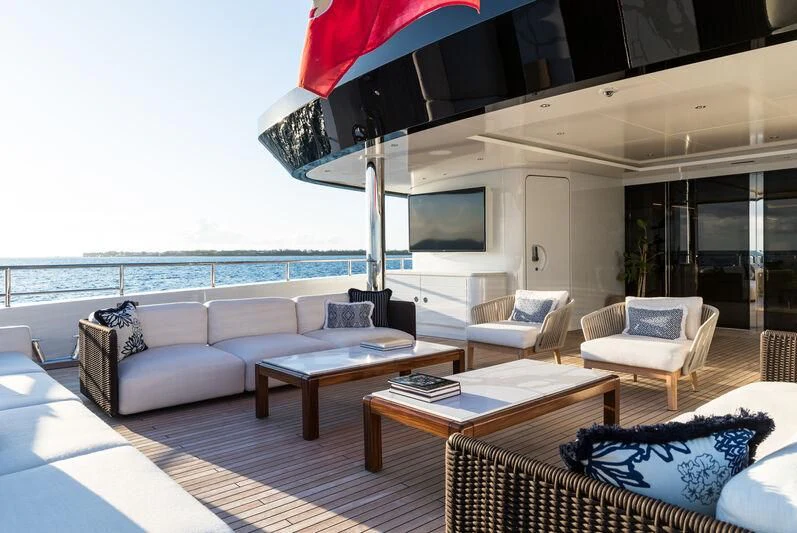 a living room with a large patio aboard CALEX Yacht for Sale