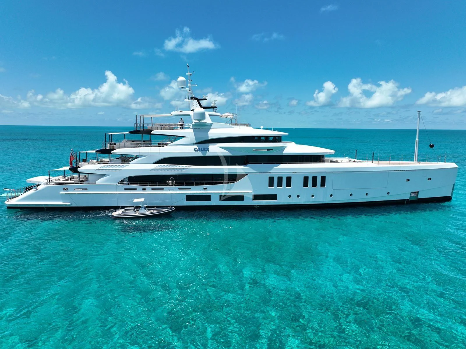 a white yacht in the ocean aboard CALEX Yacht for Sale