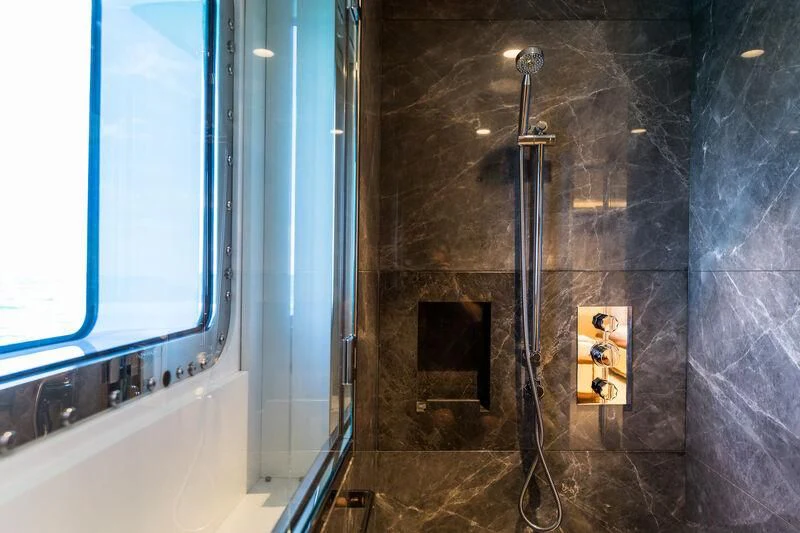 a bathroom with a shower aboard CALEX Yacht for Sale