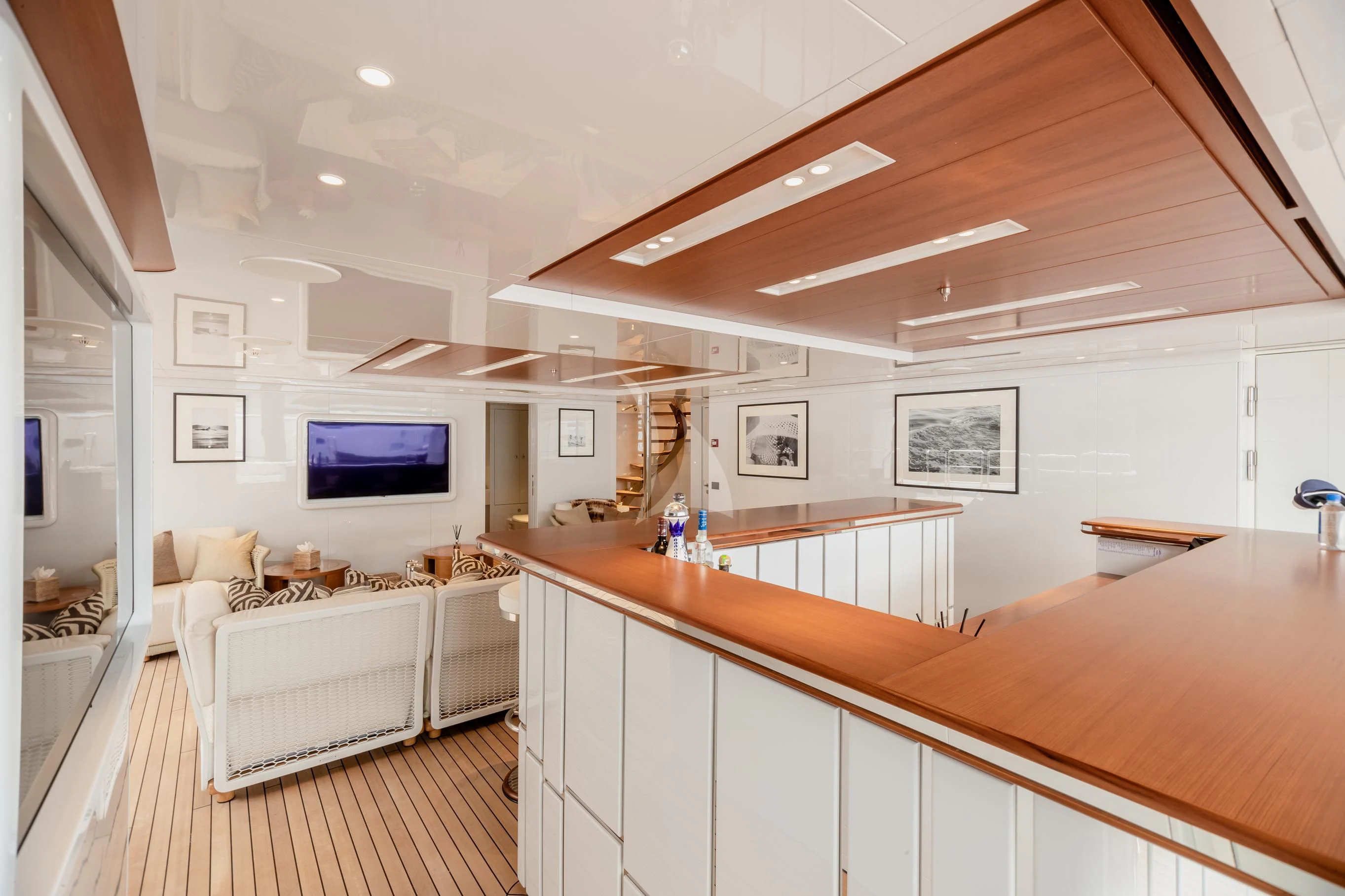 a room with a large white kitchen aboard CALEX Yacht for Sale
