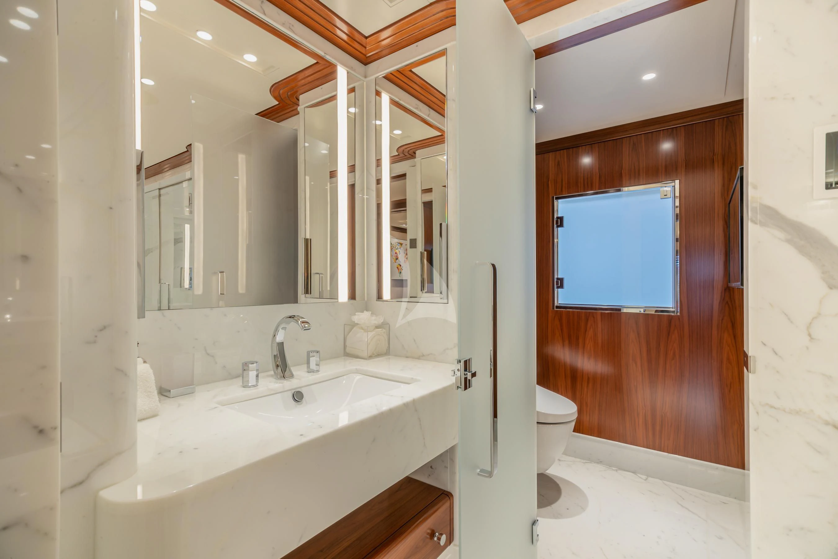 a bathroom with a sink and a toilet aboard CALEX Yacht for Sale