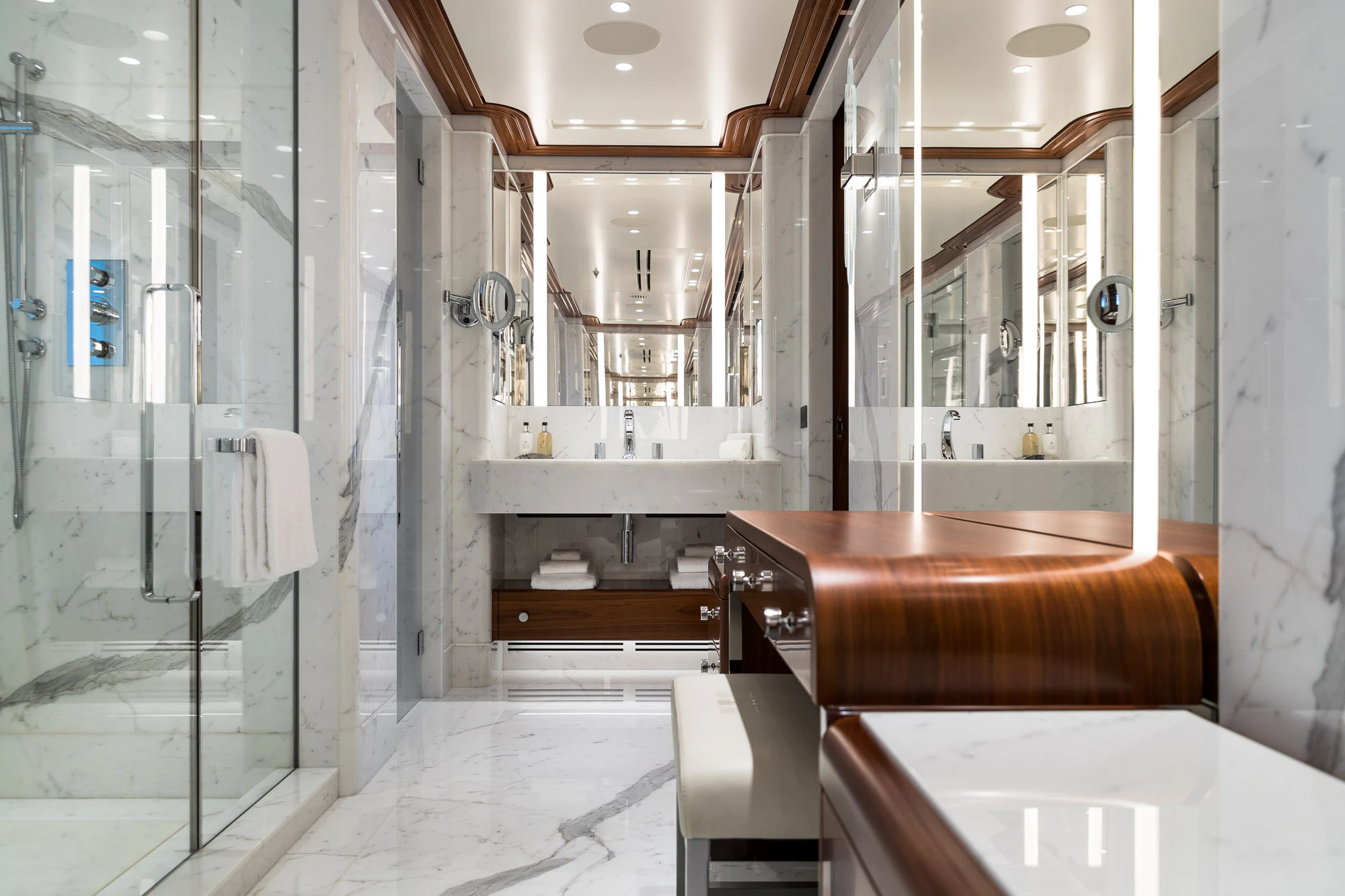a bathroom with a glass shower aboard CALEX Yacht for Sale