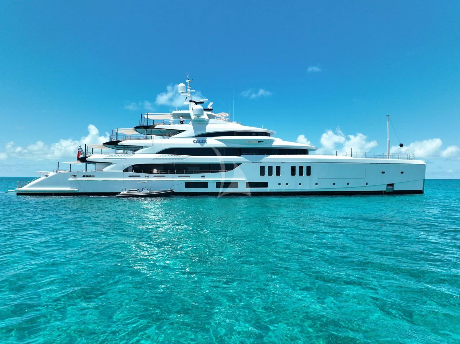 a white boat in the water aboard CALEX Yacht for Sale