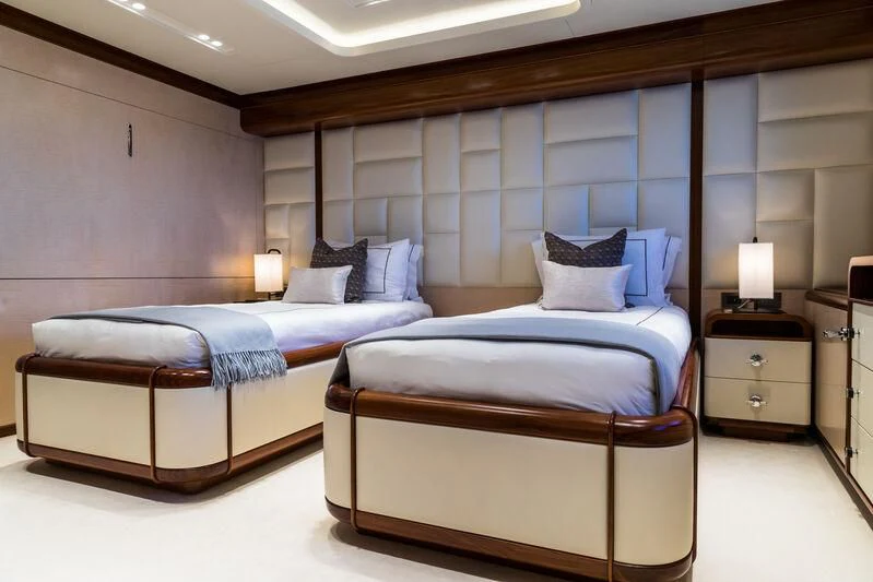 a room with two beds aboard CALEX Yacht for Sale