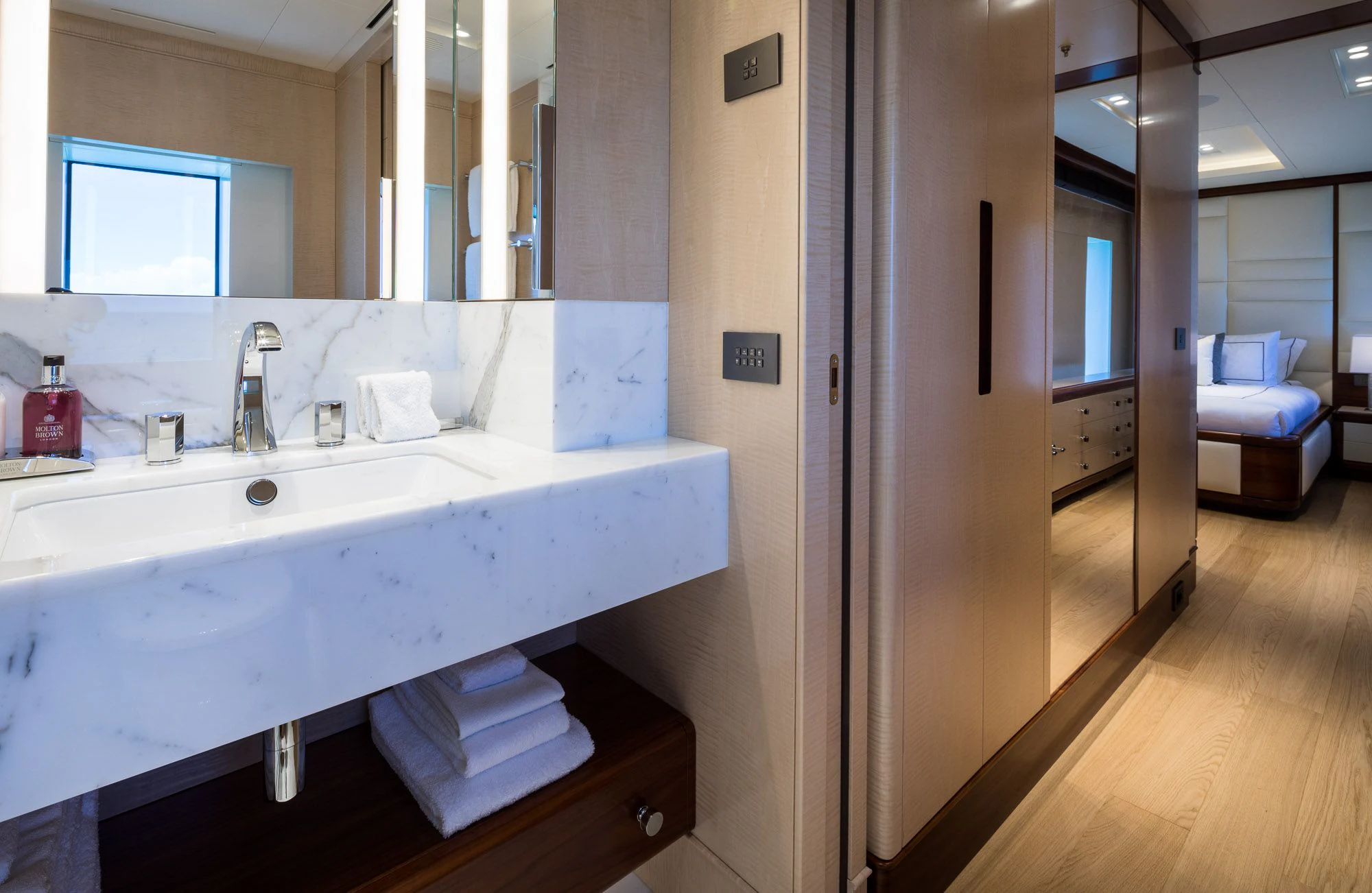 a bathroom with a sink and a mirror aboard CALEX Yacht for Sale