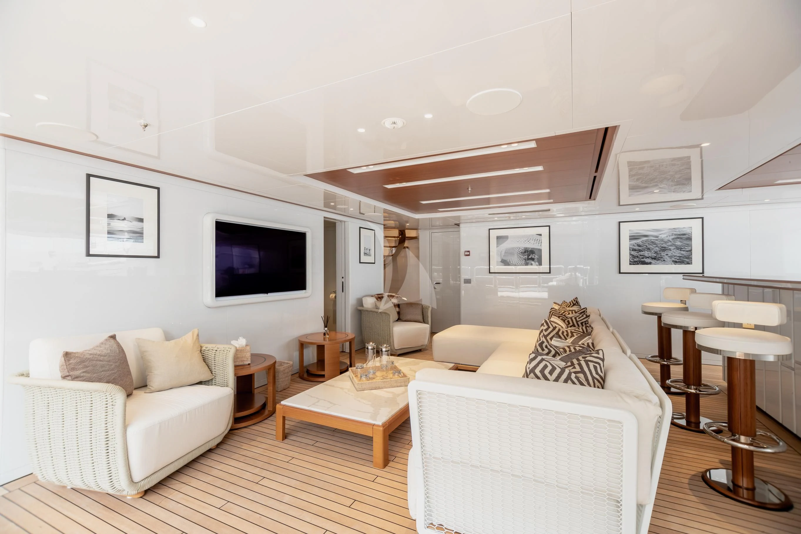 a living room with a large television aboard CALEX Yacht for Sale