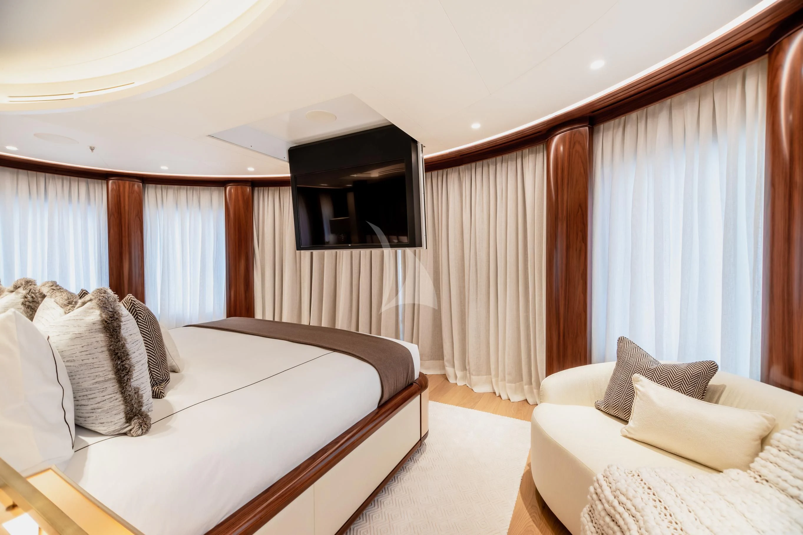 a room with a bed and a television aboard CALEX Yacht for Sale