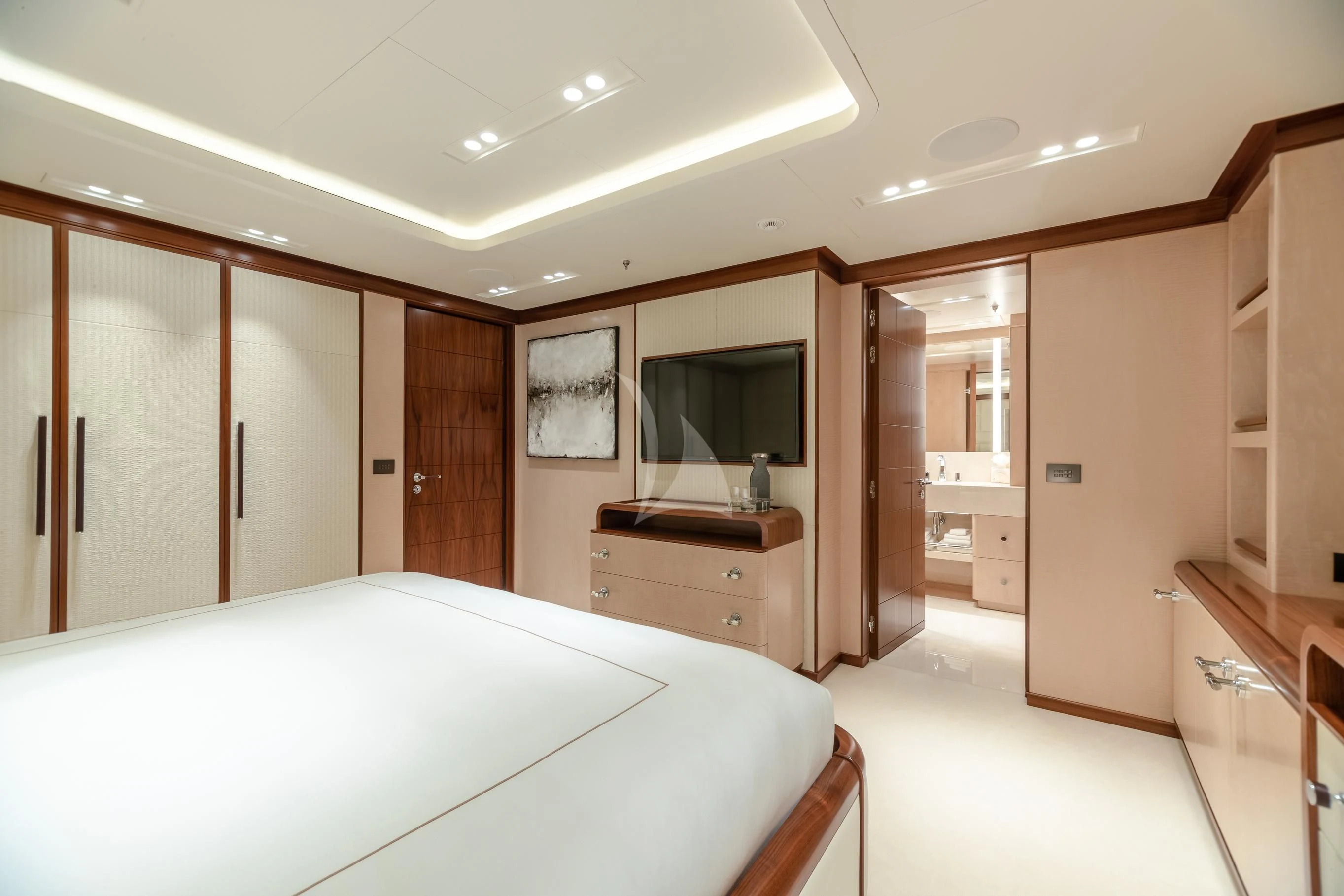 a large white bed in a room aboard CALEX Yacht for Sale