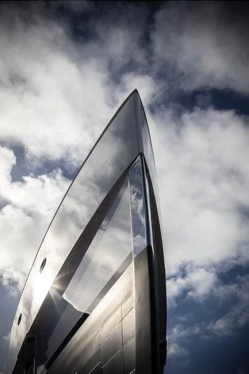 a tall building with a glass front aboard CALEX Yacht for Sale
