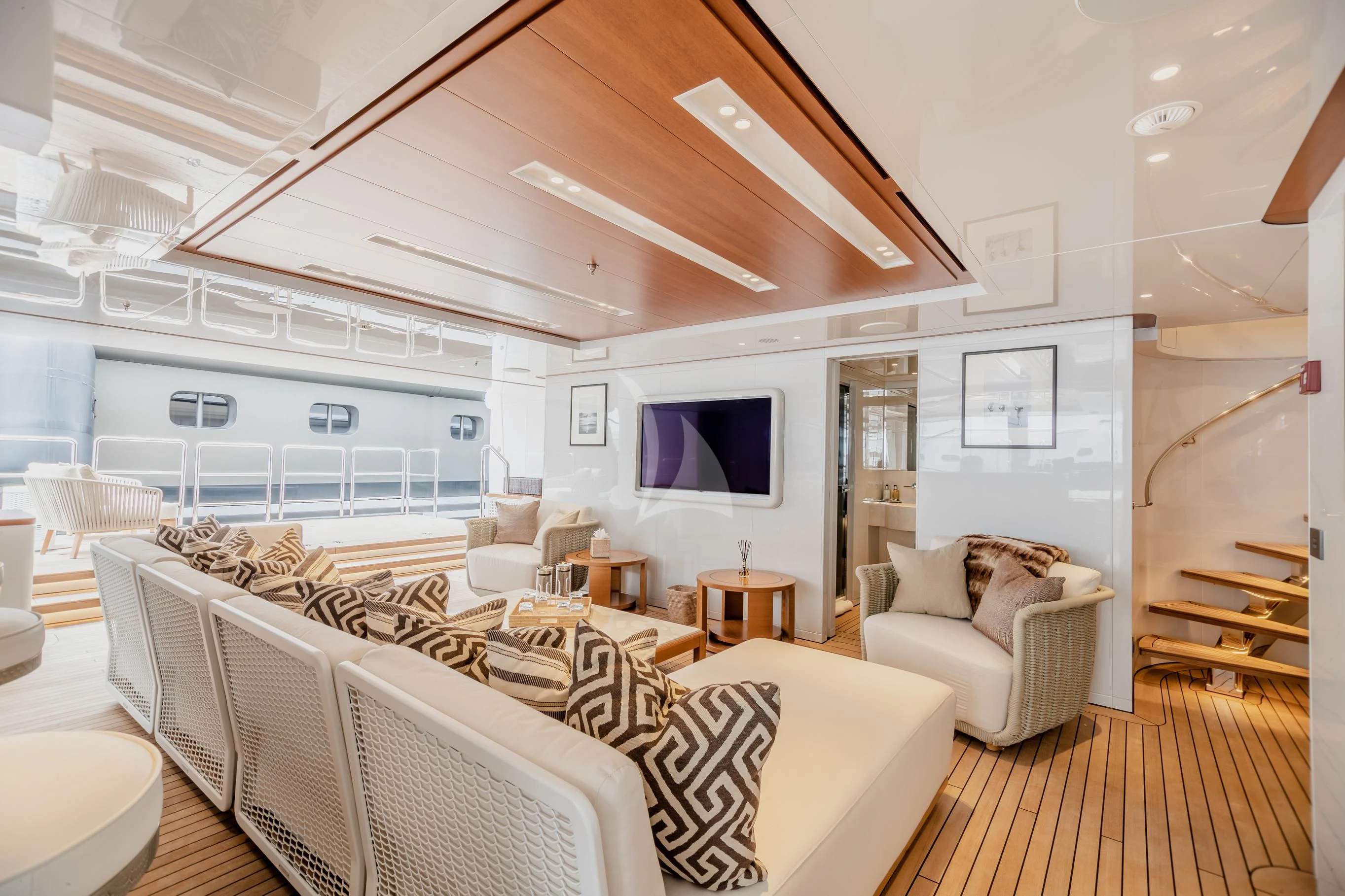 a living room with white furniture aboard CALEX Yacht for Sale