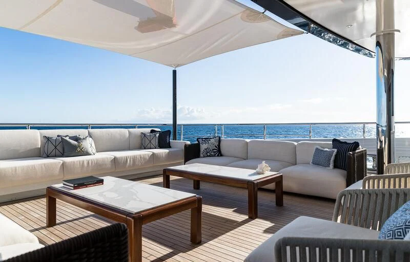 a living room with a large window aboard CALEX Yacht for Sale