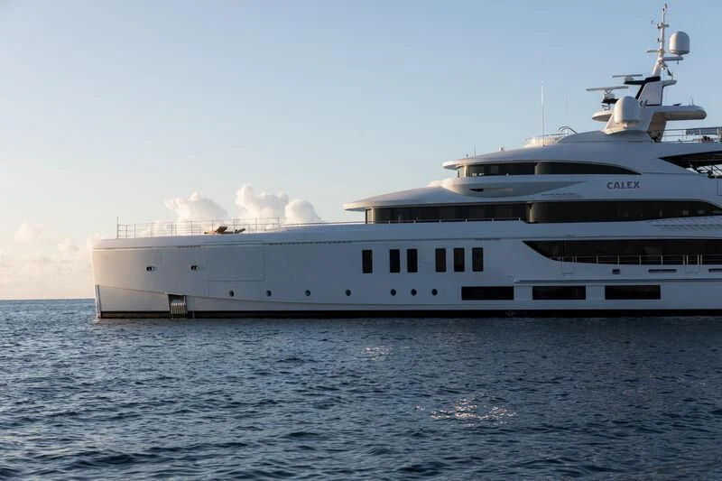 a large white ship in the water aboard CALEX Yacht for Sale