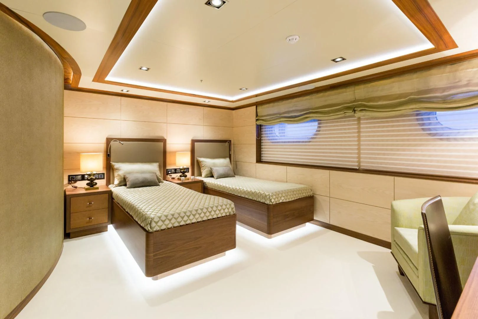 a room with a bed and a chair aboard MAYBE Yacht for Sale