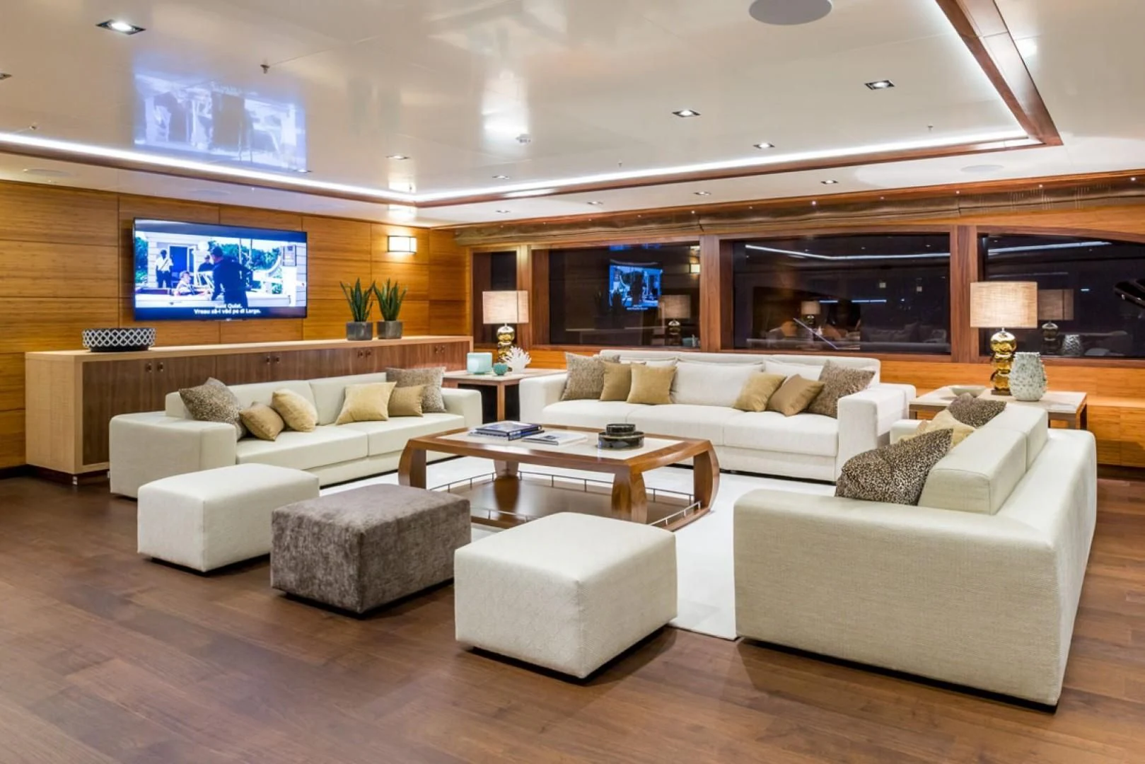 a living room with a large screen aboard MAYBE Yacht for Sale