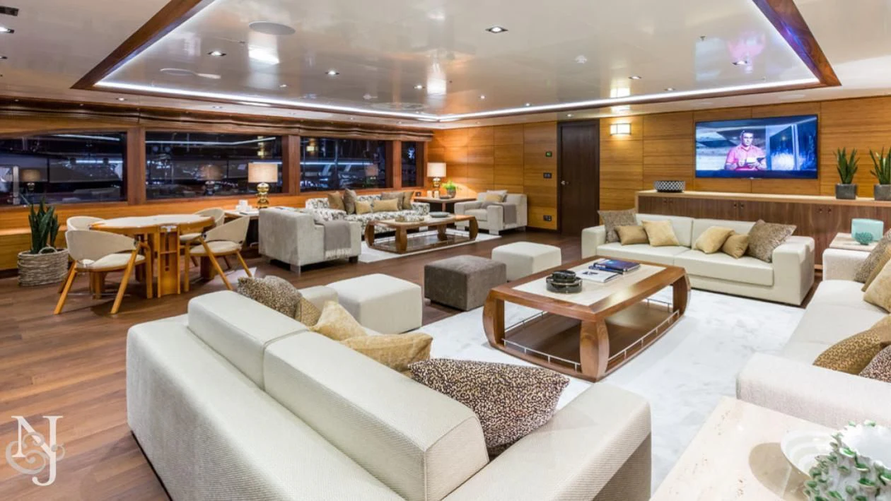 a living room with a large screen aboard MAYBE Yacht for Sale